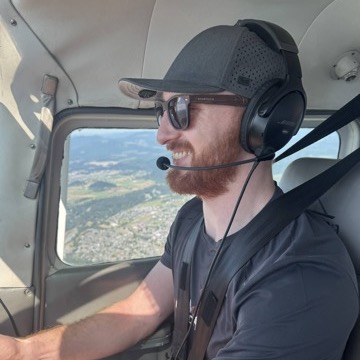 Student pilot smiling during a flight lesson