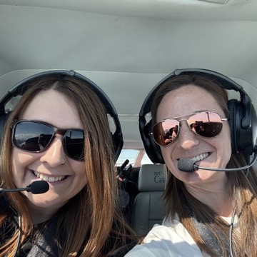 Instructor and student smiling in the Cessna cockpit